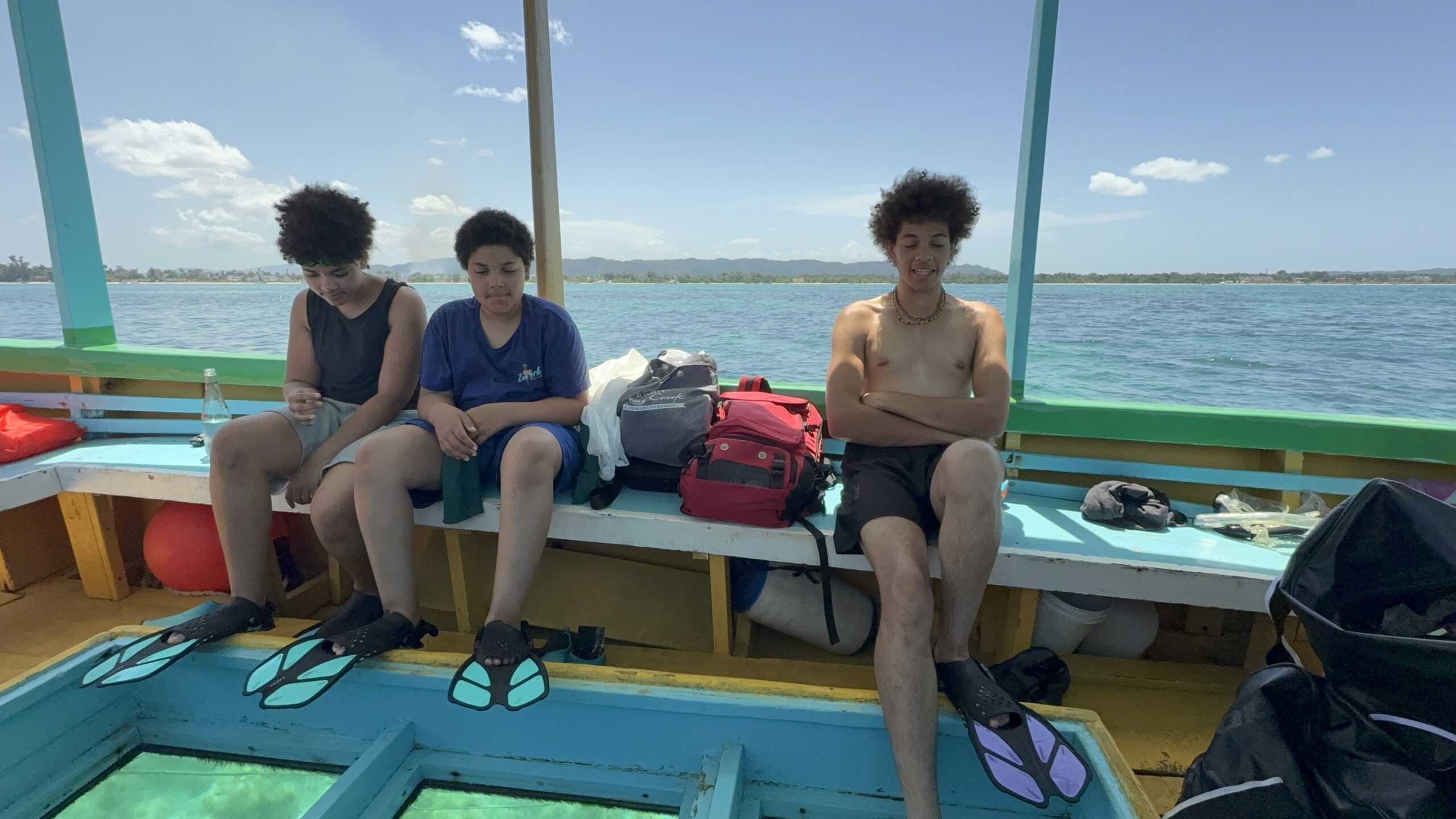 The Wander Crew on a boat in Jamaica